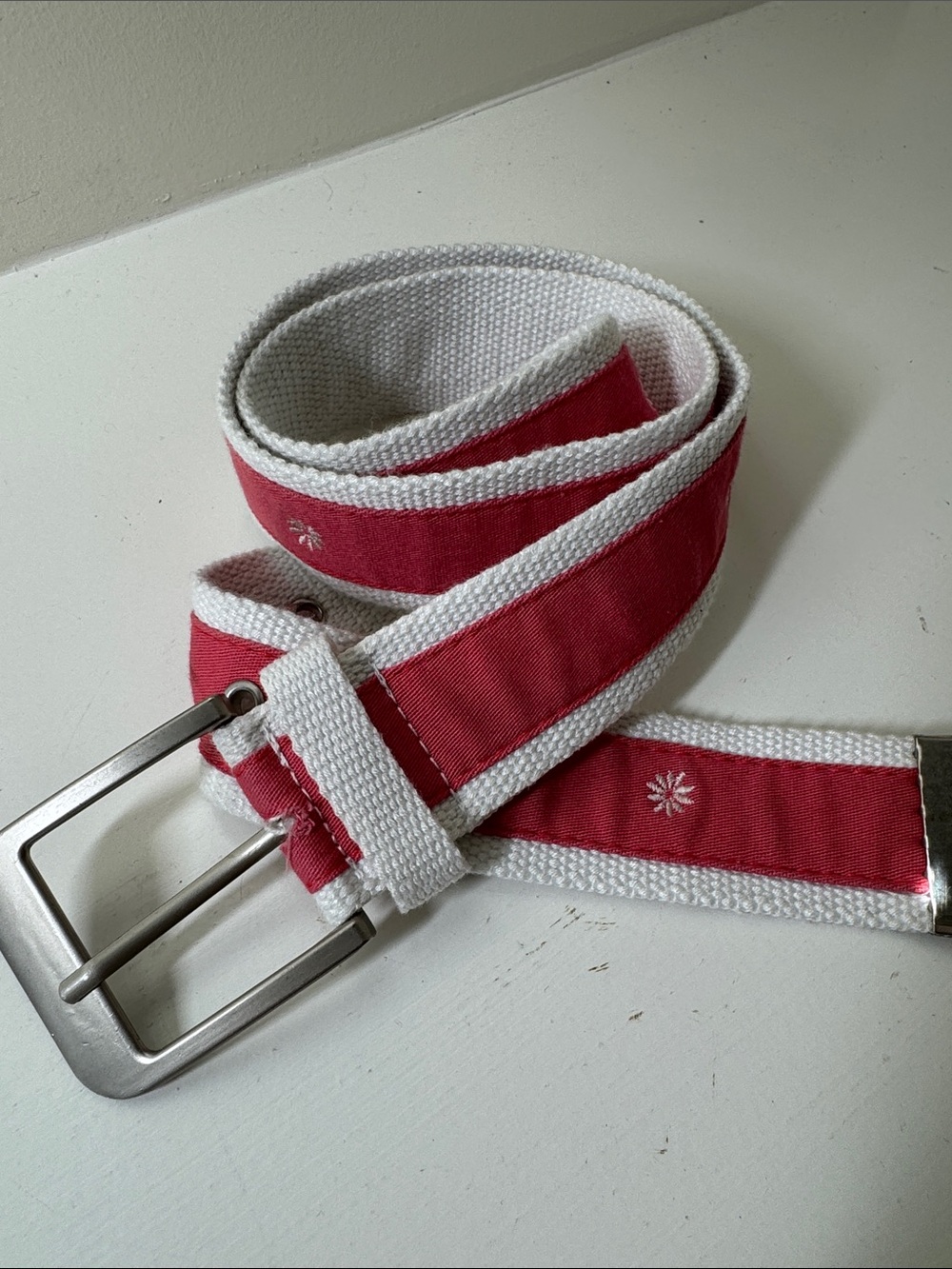 Unbranded coal and white ribboned web belt with silver tone buckle.